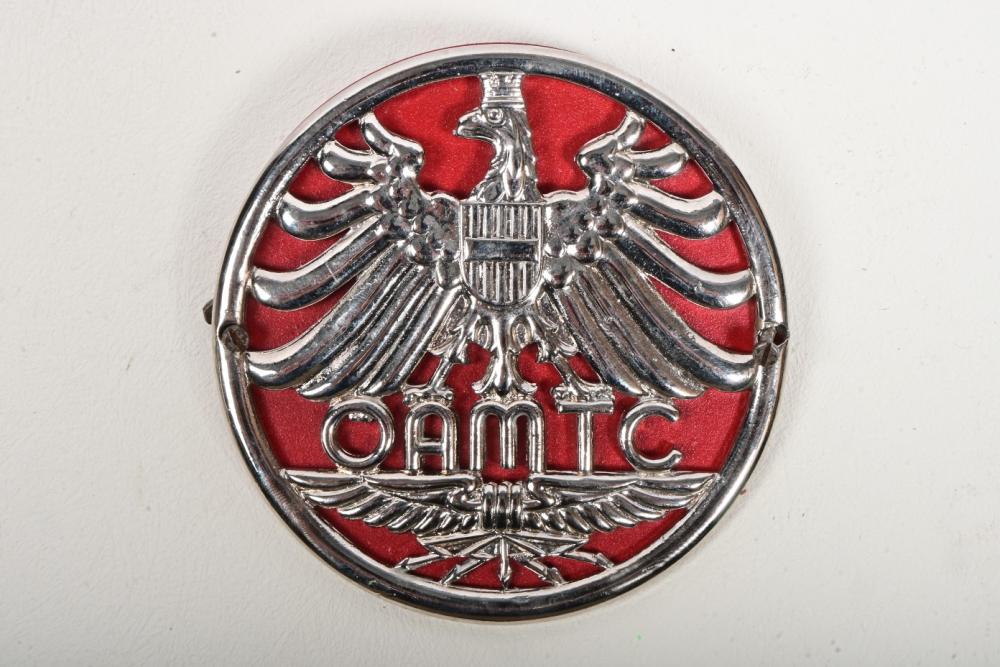 AUSTRIA: An 'Ã–sterreichische Automobil-Motorrad-und Touring Club' car club  badge issued in 1946, metal with red backing, mounting screws, 9.5cm  diameter - Price Estimate: $ - $