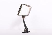 REAR VIEW MIRROR: A 1920/30s day and night rotating mirror, 13.5cm long