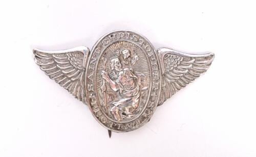 ST CRISTOPHER: A 1920s St. Christopher travellers pin badge, chrome on brass, 7.5cm wide