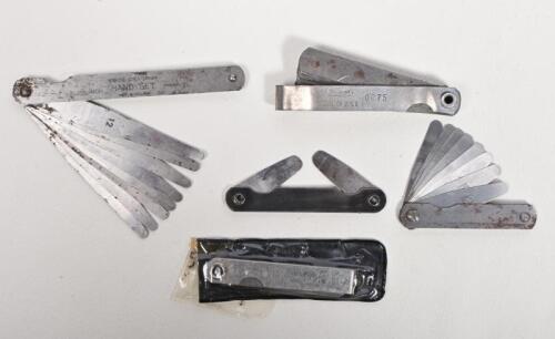 FEELER GAUGES: A collection of five feeler gauges, one with case, including Challenger, Shield and Sabone Chesterman, longest 12cm