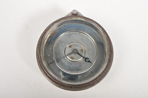 DASH CLOCK: A 1920s dash mounted clock, lacking face, possibly Jaeger, glass diameter 7.8cm, 9cm diameter overall
