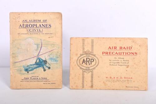 CIGARETTE CARDS: Two complete cigarette card&nbsp;albums. John Player & Sons album - 'AN ALBUM OF AEROPLANES (CIVIL)' & W.D. & H.O WILLS album - 'AIR RAID PRECAUTIONS'. Circa 1930's/1940's