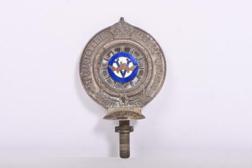 RACV: A circa 1930s Royal Automobile Club of Victoria (RACV) nickel plated brass badge by Stokes & Sons, Melbourne, with central enamelled Victorian flag to one side and enamelled RACV emblem to the other, badge number '14365', 10cm diameter, 12cm high