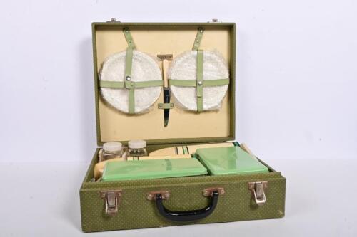 BREXTON: An original 1950s Brexton motorists complete picnic case for four with porcelain plates and cups, the case 34cm high, 40cm wide, 12cm deep