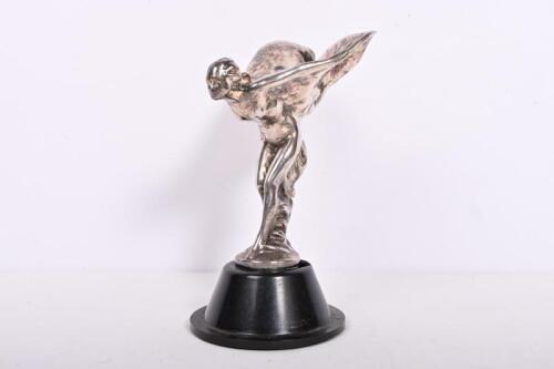ROLLS-ROYCE: A pre-war Rolls-Royce nickle plated Spirit of Ecstasy mascot by Charles Sykes, on black Bakelite base, 14cm high, 17cm high overall.