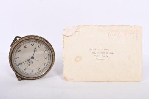 SMITHS: A circa 1925 Smiths 8 Day brass dash clock, Great Portland Street, London. H - 35,925 with a letter from Smiths in relation to the dating and other information regarding the clock,, not recently serviced or timed, glass 8cm