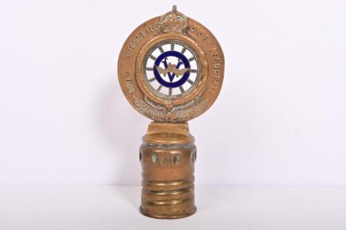ROYAL AUTOMOTIVE CLUB OF VICTORIA: A rare 1903-1908 Royal Automobile Club Assosiate cast brass badge by Stokes & Sons, Melbourne, mounted on brass radiator cap, with central enamelled Victorian flag to one side and enamelled veteran car to the other, memb