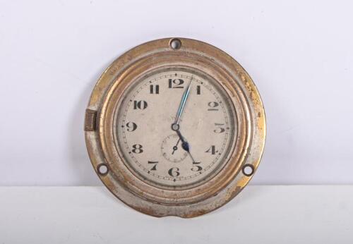 DASH CLOCK: A rim wind 8 day clock, Swiss made in working condition, glass 6.5cm diameter