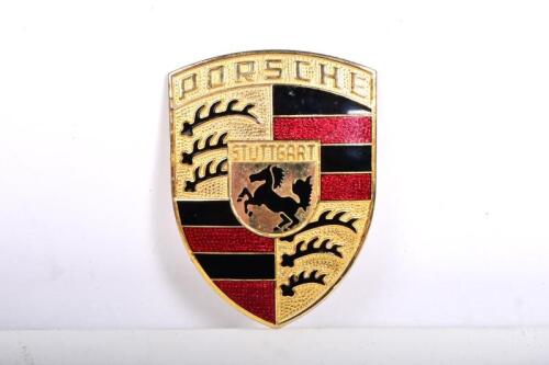 A Porsche&nbsp;enamel and brass bonnet badge, 7cm high