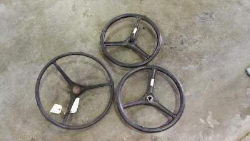 STEERING WHEELS: Three steering wheels, one likely Massey-Harris