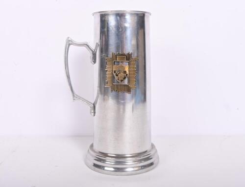 PITSTOP MOTORS: A tall tankard with applied plaque 'Pitstop Motors, Sales Through Service', 23cm high.