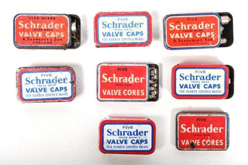 SCHRADER: A collection of eight Schrader tin boxes containing valve caps and valve cores, some incomplete, longest 3.5cm