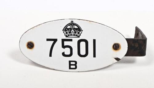 ENAMEL PLATE: An Edwardian official vehicle enamelled plate, numbered 7501 B surmounted by a crown, with mounting bracket, 15cm long