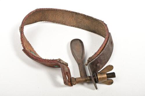 SPARE TYPE CLAMP: A vintage running board spare tyre strap and clamp,13cm diameter
