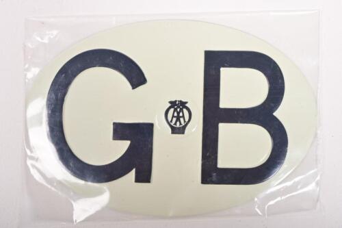 AA: A NOS circa 1980s Great Britain 'GB' international letter plate by the AA, alloy, black on white background, in original plastic unopened packaging, 12 x 18cm high