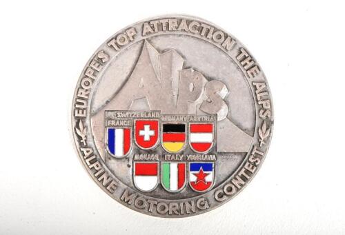 ALPINE MOTORING CONTEST: An Alpine Motoring Contest car badge by Huguenin, enamelled flags of participating countries, nickel on brass, 8cm diameter