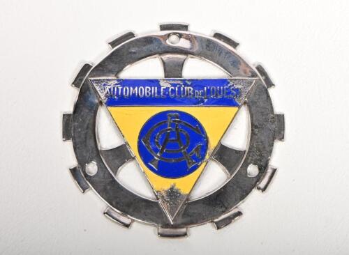 A.C.O: An 'AUTOMOBILE CLUB DE L'OUEST' car club badge, nickel plated with central enamelled triangular yellow and blue 'A.C.O' emblem, 7cm diameter, lacking some enamel to points of triangle
