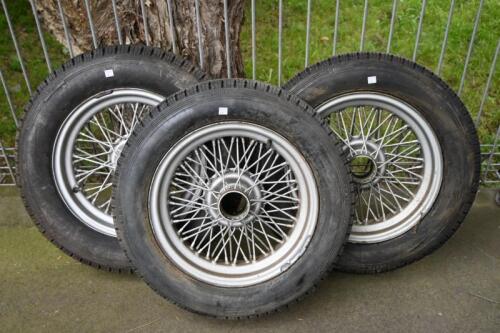 WIRE WHEELS: Three 15 inch' triple laced wire wheels with fitted hard tires