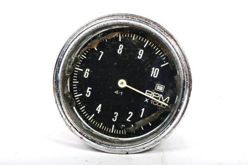 GAUGE: A large circa 1960s Stewart&nbsp;Warner 10,000 RPM gauge, with&nbsp;Beechcraft 76BE '106301' tachometer adapter attached to rear, 9.5cm diameter overall