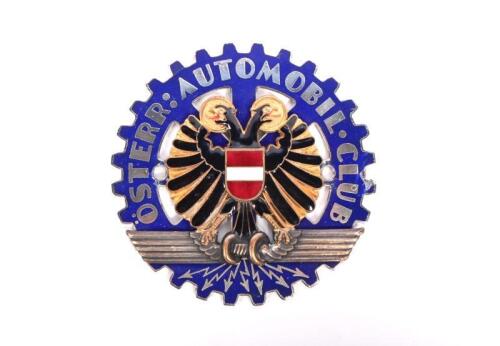 BADGE: A 1920s Austrian "Osterr Automobil Club" badge, with golden plated brass and enamel, number to reverse "251" and stamped "STOEGER WIEN VIL", 9.7cm diameter