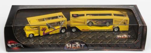 HOT WHEELS: A NOS 1:64 scale Hot Wheels "Haulin Heat" Vehicle Set comprising Auto Transport with 2 Vehicles die-cast models