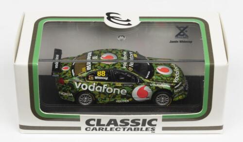 HOLDEN: A NOS 1:64 scale Classic Carlectables Holden VE Commodore 2011 Team Vodaphone Jamie Whincup #88 Camouflage Livery die-cast model