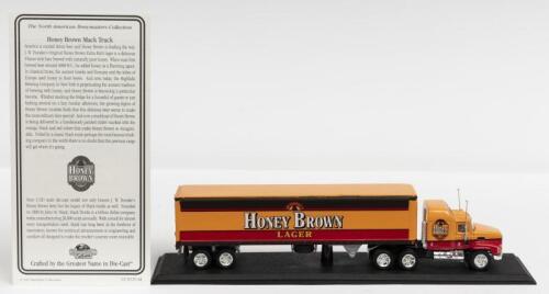 MACK: A NOS 1:100 scale Matchbox Mack Truck with "Honey Brown Lager" Trailer with Certificate of Authenticity die-cast model