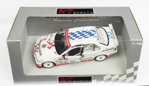 BMW: A NOS 1:18 scale UT Models BMW 320i #5 1997 STW "Warsteiner" J. Cecotto die-cast model