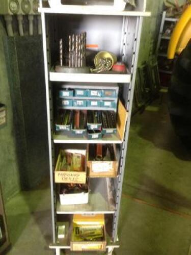 DRILLING: A small upright cabinet contain drill bits and related items
