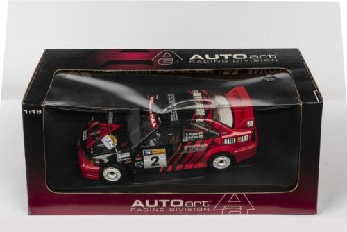 MITSUBISHI: A NOS 1:18 scale Autoart Mitsubishi Lancer Evolution VI WRC 1999 Rally of Canberra Winner "Ralliart" #2 die-cast model
