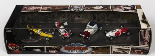 HOT WHEELS: A NOS Hot Wheels 4 vehicle set "Bruce Meyer Gallery" comprising Greer-Black-Prudhomme dragster/The Agajanian Special dirt car #98/ 1934 Ford Coupe #2D/So-Cal Belly Tank dry lake racer #28 die-cast models