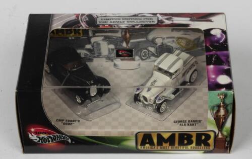 HOT WHEELS: A NOS Hot Wheels Twin Set "AMBR America's Most Beautiful Roadsters" comprising "Chip Foose's 0032" & "George Barris' Ala Kart" die-cast models