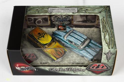 HOT WHEELS: A NOS Hot Wheels Twin Set - "Troy Lee Designs" comprising "Go-Mad" & 1957 Cadillac die-cast models