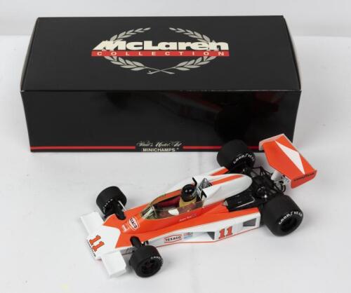 McLAREN: A NOS 1:18 scale Minichamps Formula 1 McLaren Ford M23 James Hunt #11 "Texaco" 1976 die-cast model