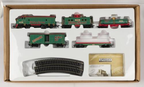 TRAIN PACK: A NOS HO scale Matchbox "Holiday Express" Train Pack comprising Locomotive and 4 wagons, each with die-cast bodies, track included