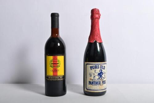 RACING WINE: Two bottles of alcohol. 1984 '49th AUSTRALIA DUNLOP GRAND PRIX ' labelled bottle of 1980 CLARET by Thomas Hardy & Sons & Champagne bottle of 'PURE OLD PANTHER PISS'