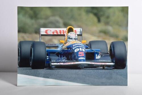 MANSELL: A colour picture of Nigel Mansell driving a Williams FW14B. Picture signed by Nigel Mansell