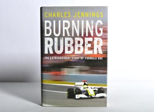 FORMULA 1: 'BURNING RUBBER' hardcover book by Charles Jennings. Title page signed by Rubens Barrichello, Jenson Button, Ross Brawn