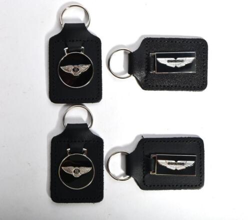 KEYRINGS: Four keyrings. Two 'ASTON MARTIN' and two 'BENTLEY' keyrings