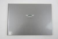 V12 VANQUISH: An Aston Martin V12 Vanquish sales brochure.