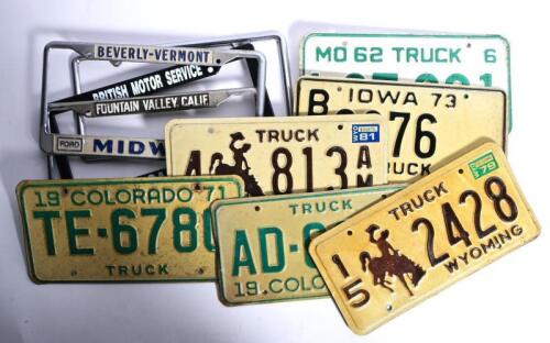 U.S TRUCK PLATES: A group of U.S truck plates and number plate surrounds. Colorado, Iowa, Wyoming truck plates