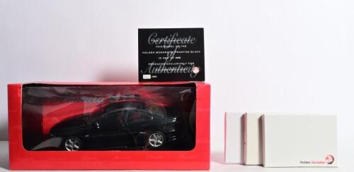 HOLDEN: Four Holden related items. Limited Edition Official Holden 1:18 scale model of a Holden Monaro as produced exclusively for Holden employees. Numbered 0341/8598. 'Holden. Go better.' collector cards