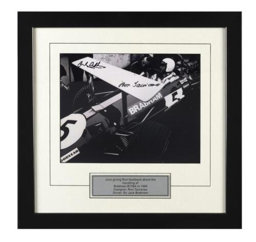 BRABHAM: A black and white image of Sir Jack Brabham giving Ron Tauranac feedback about the handling of the Brabham BT26A during the 1969 Grand Prix season. Image signed by Sir Jack Brabham and designer Ron Tauranac