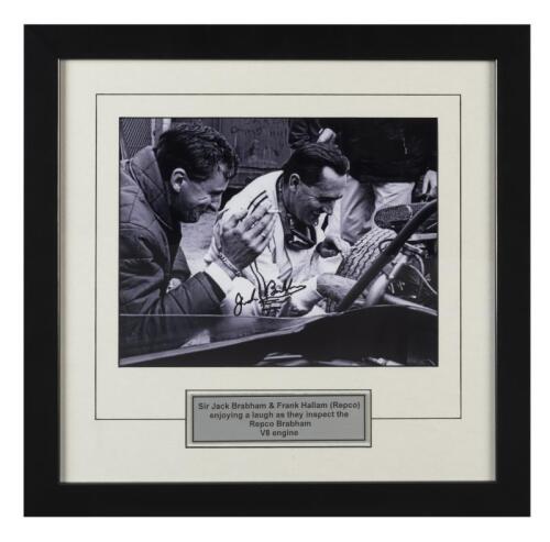 BRABHAM: A black and white image of Sir Jack Brabham & Frank Hallam (Repco) inspecting the Repco Brabham V8 engine. Image signed by Sir Jack Brabham