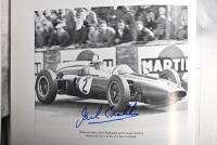 GRAND PRIX: 'THE GRAND PRIX DRIVERS' softcover book. Book signed by 10 World Champions and 5 Grand Prix winners. Signatures include Juan Manuel Fangio, Denis Hulme, Alan Jones, Rene Arnoux, Stirling Moss & Patrick Tambay. Superb signature set - 8