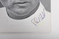 GRAND PRIX: 'THE GRAND PRIX DRIVERS' softcover book. Book signed by 10 World Champions and 5 Grand Prix winners. Signatures include Juan Manuel Fangio, Denis Hulme, Alan Jones, Rene Arnoux, Stirling Moss & Patrick Tambay. Superb signature set - 12