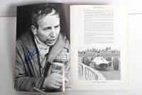 GRAND PRIX: 'THE GRAND PRIX DRIVERS' softcover book. Book signed by 10 World Champions and 5 Grand Prix winners. Signatures include Juan Manuel Fangio, Denis Hulme, Alan Jones, Rene Arnoux, Stirling Moss & Patrick Tambay. Superb signature set - 13