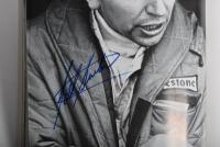 GRAND PRIX: 'THE GRAND PRIX DRIVERS' softcover book. Book signed by 10 World Champions and 5 Grand Prix winners. Signatures include Juan Manuel Fangio, Denis Hulme, Alan Jones, Rene Arnoux, Stirling Moss & Patrick Tambay. Superb signature set - 14