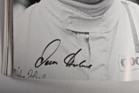 GRAND PRIX: 'THE GRAND PRIX DRIVERS' softcover book. Book signed by 10 World Champions and 5 Grand Prix winners. Signatures include Juan Manuel Fangio, Denis Hulme, Alan Jones, Rene Arnoux, Stirling Moss & Patrick Tambay. Superb signature set - 16
