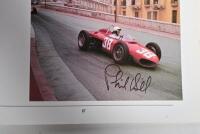 GRAND PRIX: 'THE GRAND PRIX DRIVERS' softcover book. Book signed by 10 World Champions and 5 Grand Prix winners. Signatures include Juan Manuel Fangio, Denis Hulme, Alan Jones, Rene Arnoux, Stirling Moss & Patrick Tambay. Superb signature set - 17